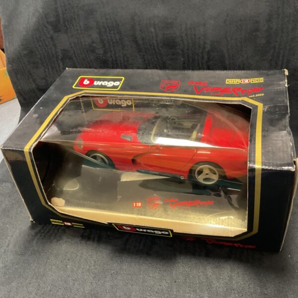 Red Burago Dodge Viper RT10 diecast model car, collectible.