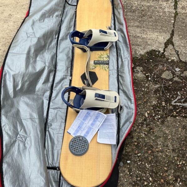 Burton snowboard with carry case, ready for winter sports.
