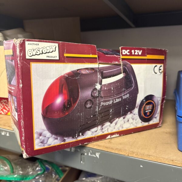 Busybody DC 12V inflator in original packaging, showing the product details.