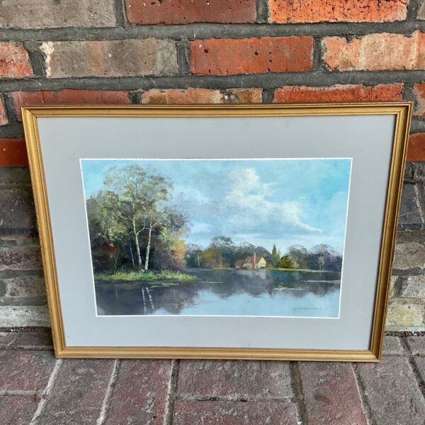Signed C Crocker oil painting of a peaceful lake and cottage.