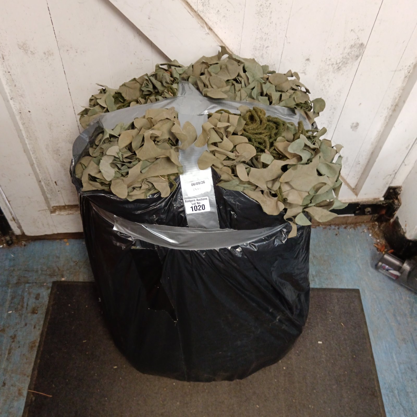 Large sack of military camo netting for outdoor use.
