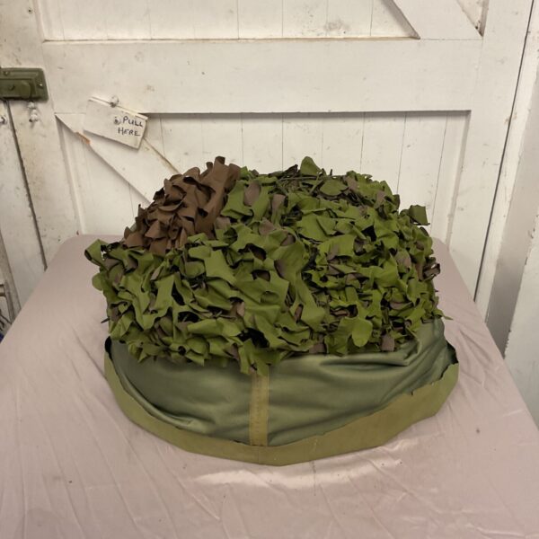 Green camouflage netting for outdoor concealment and military use.