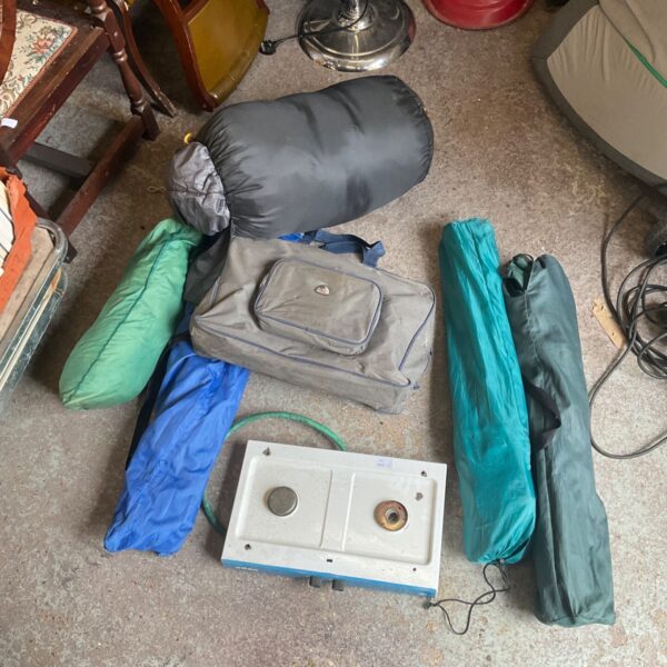 Camping equipment lot including tent, stove and chairs.
