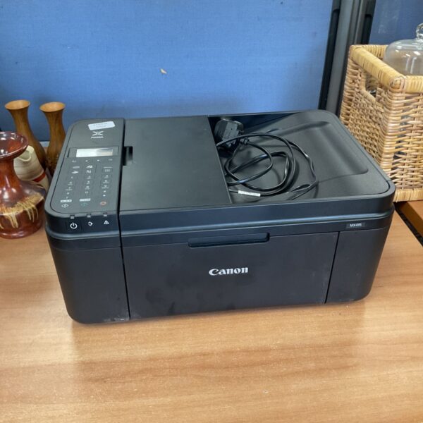 Canon Pixma MX495 printer, a compact all-in-one inkjet device.