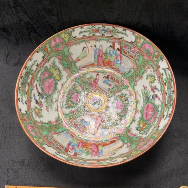 Antique Canton Famile Rose bowl with detailed floral and figure scenes.
