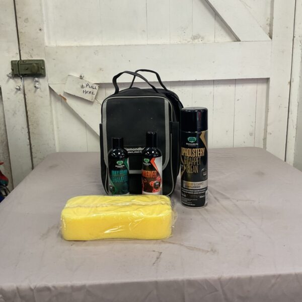 Car cleaning kit with Simoniz products and microfibre cloth.