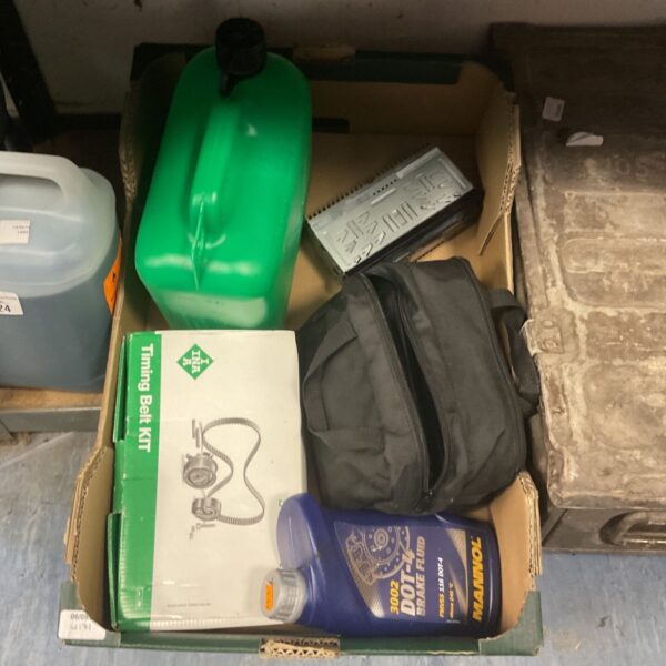 Car maintenance lot including timing belt kit and brake fluid.