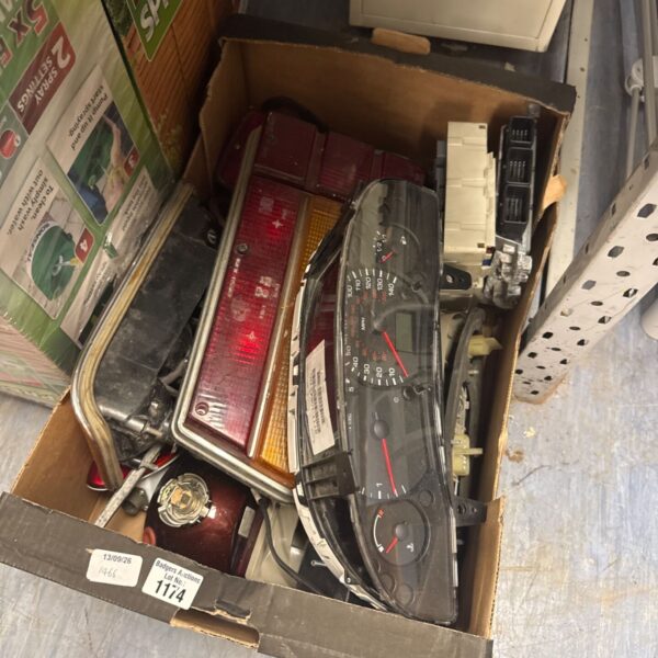 Tray of assorted car parts including lamps and an ECU.