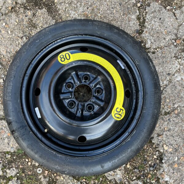 Used car spare wheel T125/70R16 for emergency tyre replacement.