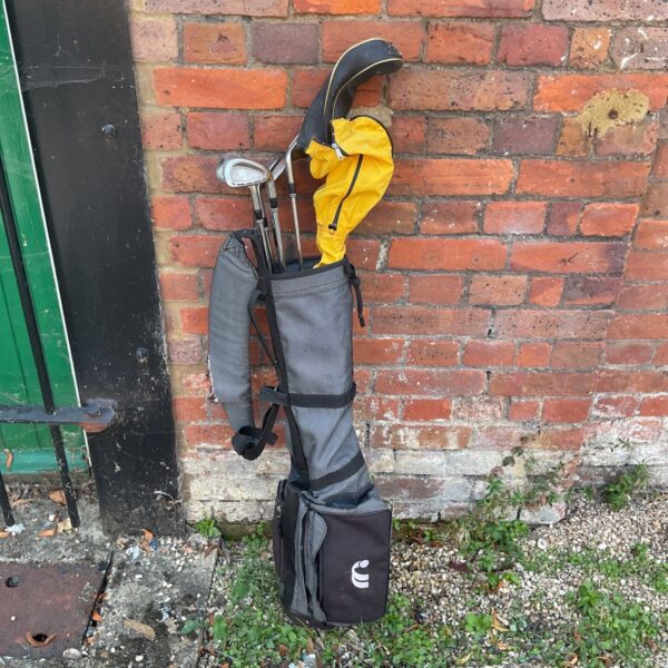 Dark grey Cargo Pro-500 golf bag with clubs visible.