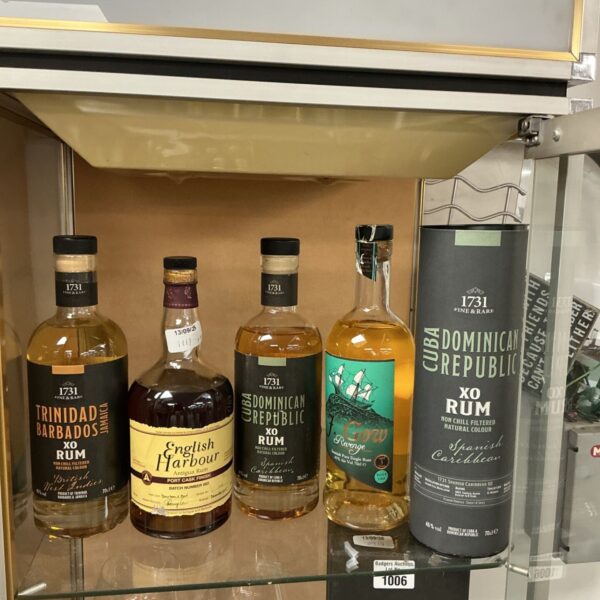 Collection of Caribbean rum bottles, including 1731 Dominican Republic.