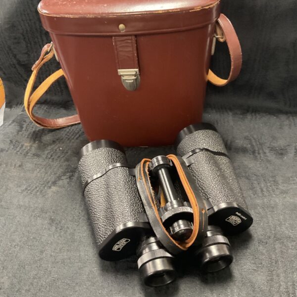 Vintage Carl Zeiss Jena binoculars with leather case displayed.