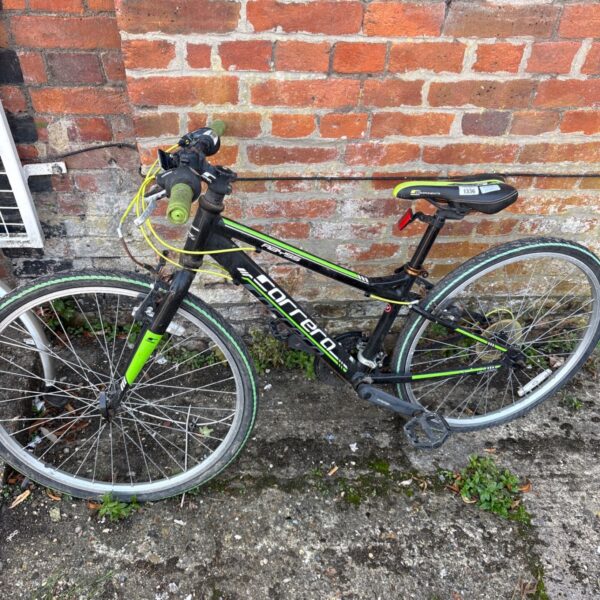Used Carrera Abyss childs mountain bike in outdoor setting.