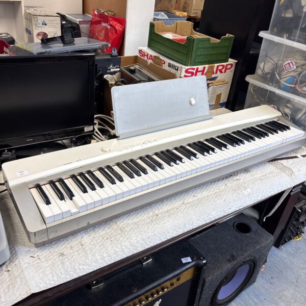 Casio Privia PX-130 digital piano with keys visible.
