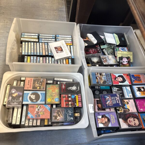 Four boxes filled with a vintage cassette tape collection.