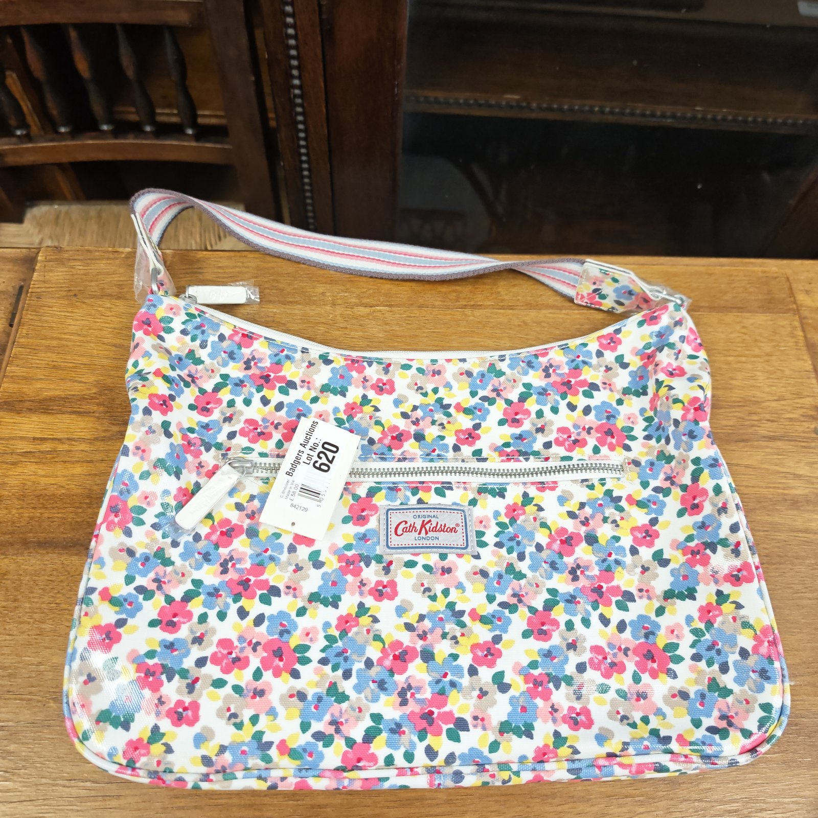 Unused Cath Kidston floral handbag with tags, a vibrant shoulder bag.