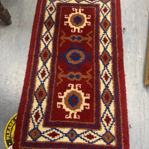 Hand knotted Caucasian Kazak rug with geometric medallions.