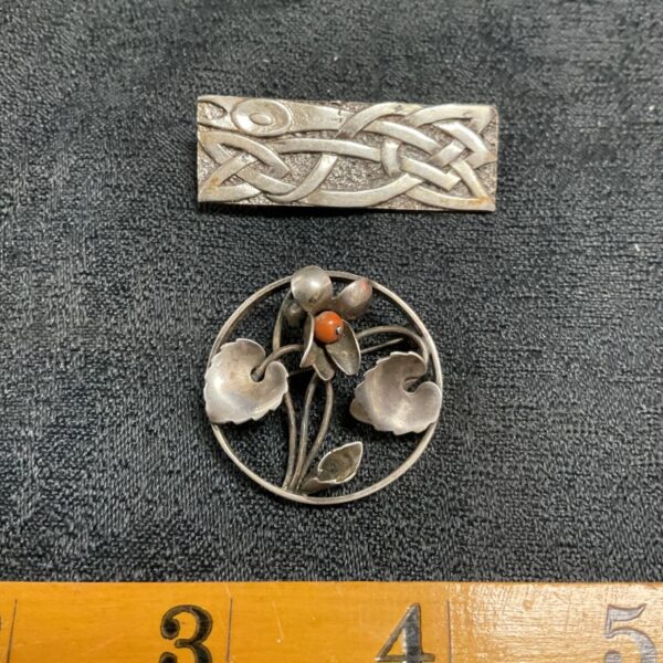 Vintage Celtic Art Nouveau silver brooch with intricate detailing.