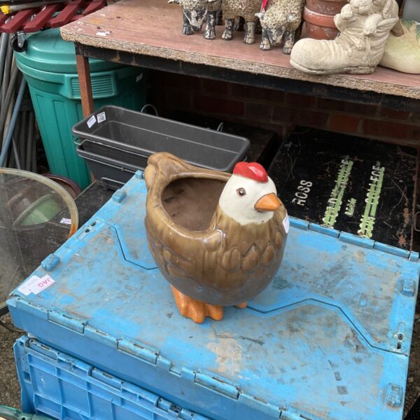 Vintage ceramic chicken plant pot for garden or home decor.