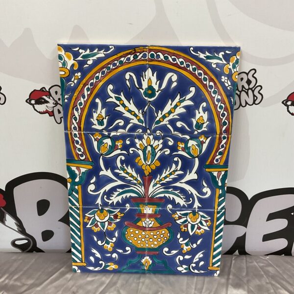 Vintage ceramic wall tile with a floral pattern.