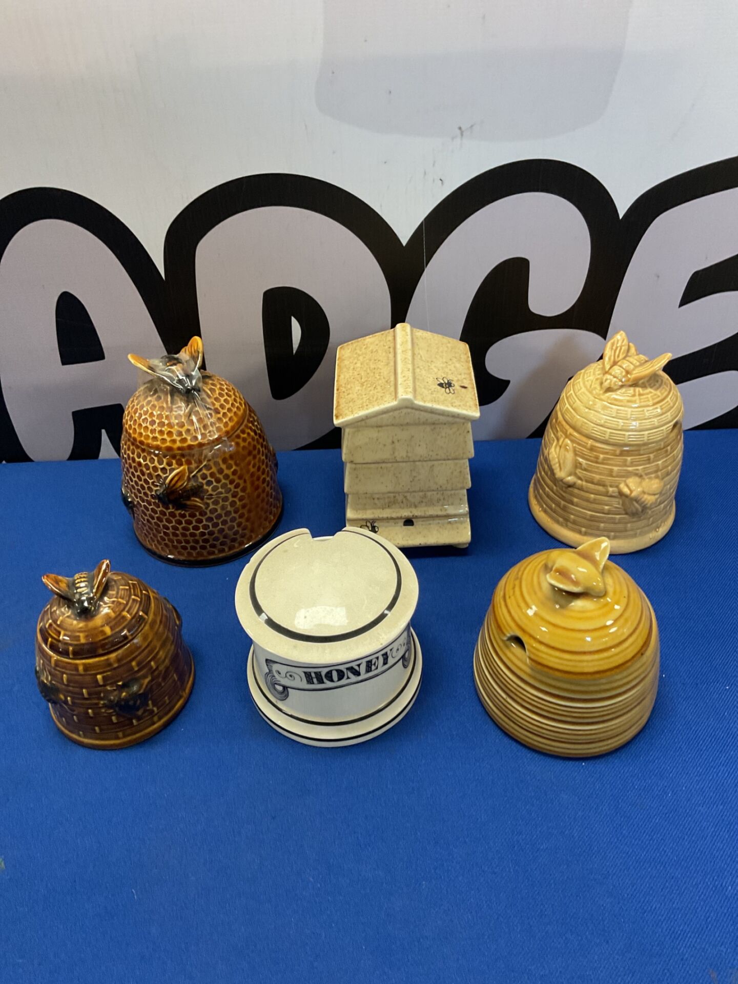 092 Six ceramic honey pots including ditto