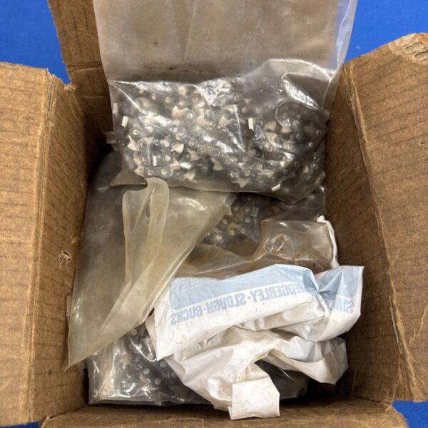 Assorted replacement chainsaw chains in a cardboard box.