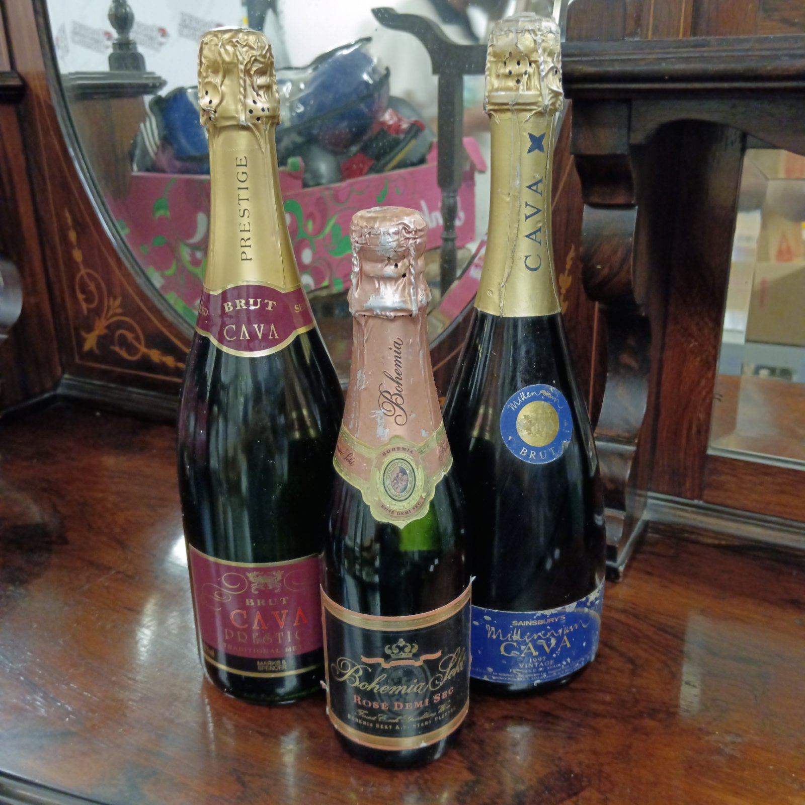 Sealed bottles of champagne and cava for wine collectors.