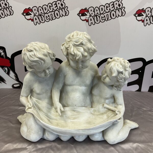 Detailed resin cherub sculpture with three angelic figures.