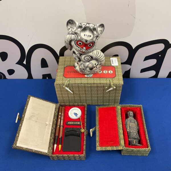 Traditional Chinese clay monkey figurine with terracotta warrior and calligraphy set.