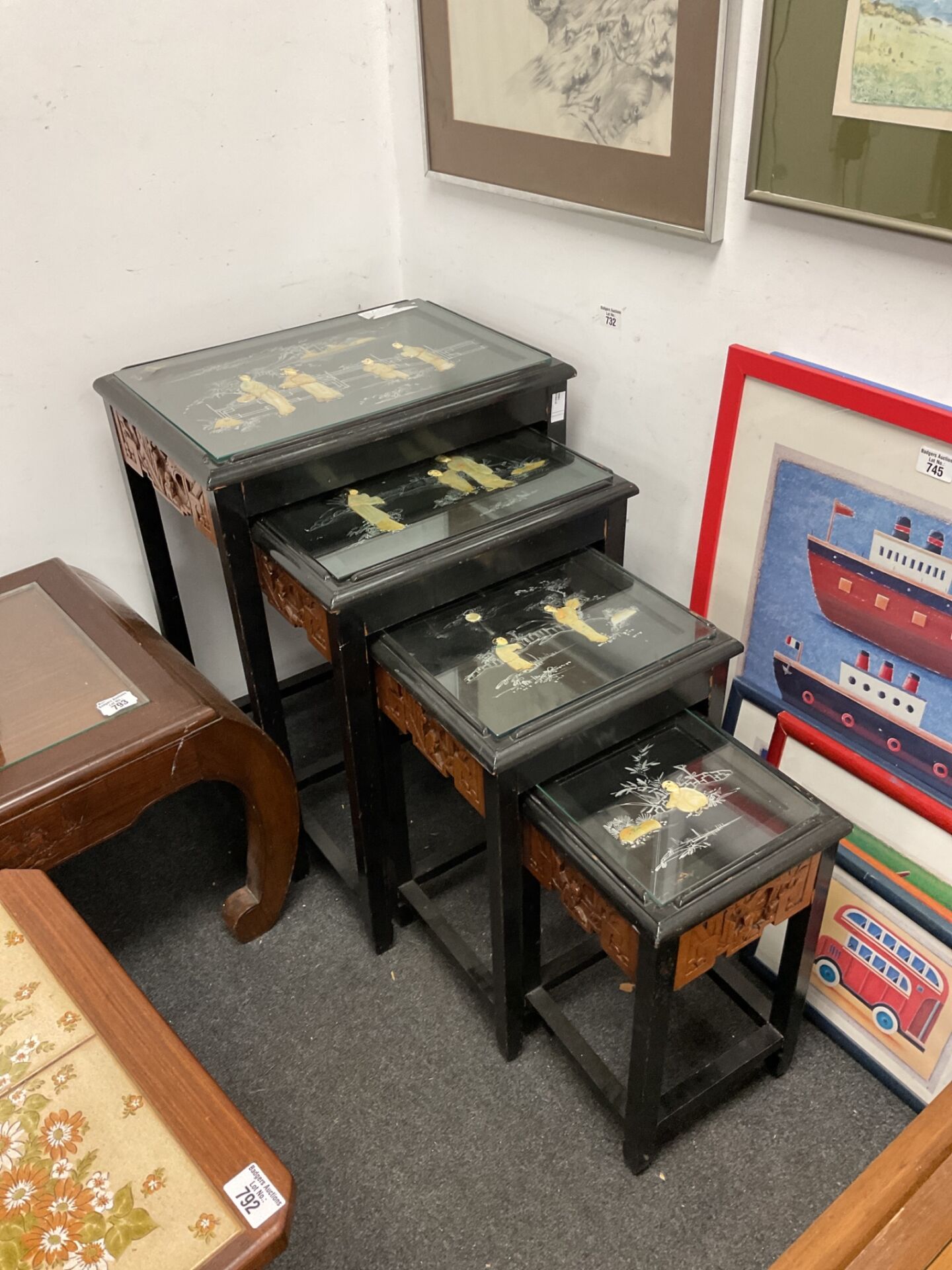 791 Nest of 4 Chinese lacquered tables with mother of pearl figures & carved sides