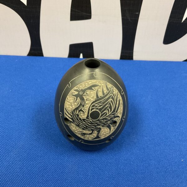 Detailed Chinese *xun* flute with bird carving.