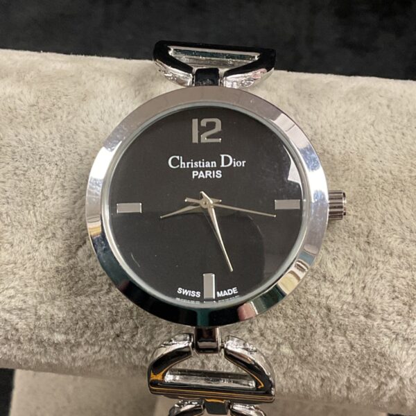 Christian Dior Bagheera watch with black face and chrome strap.