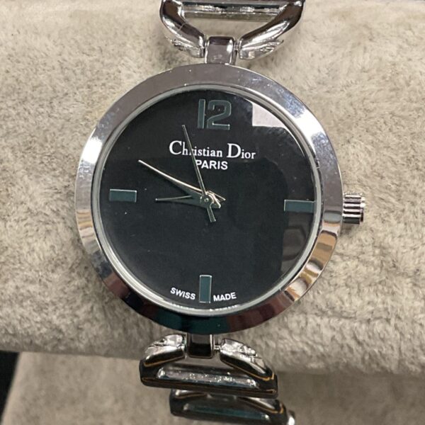 Christian Dior Paris watch with black dial and silver band.