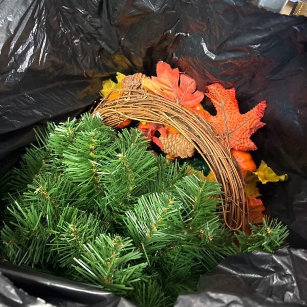Bundle of Christmas decorations including garland and wreath.