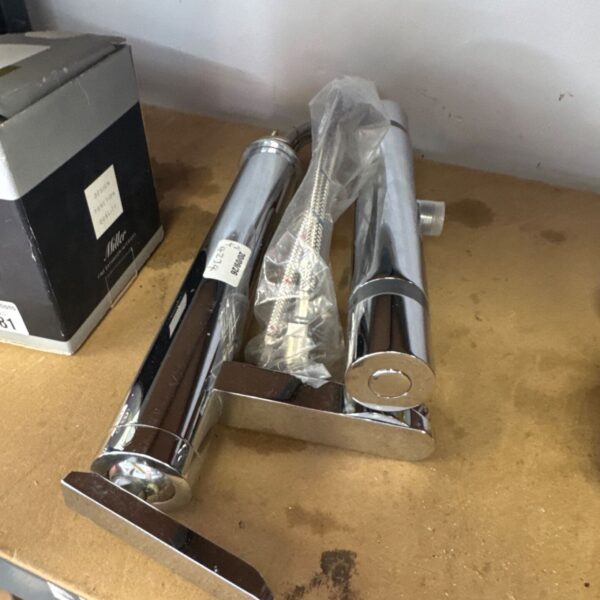 Chrome mixer tap pair with tails, vintage bathroom fixture.