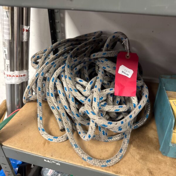 Braided nylon climbing rope, showing signs of wear.