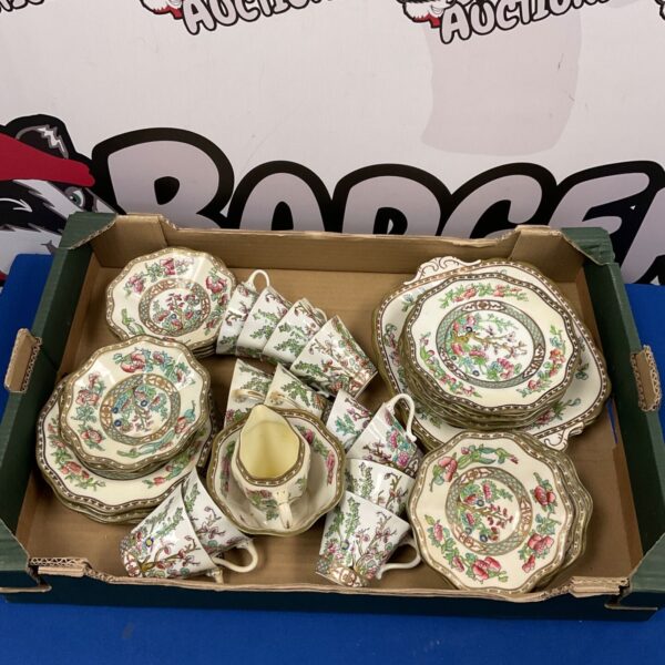 Vintage Coalport tea set with floral design on display.