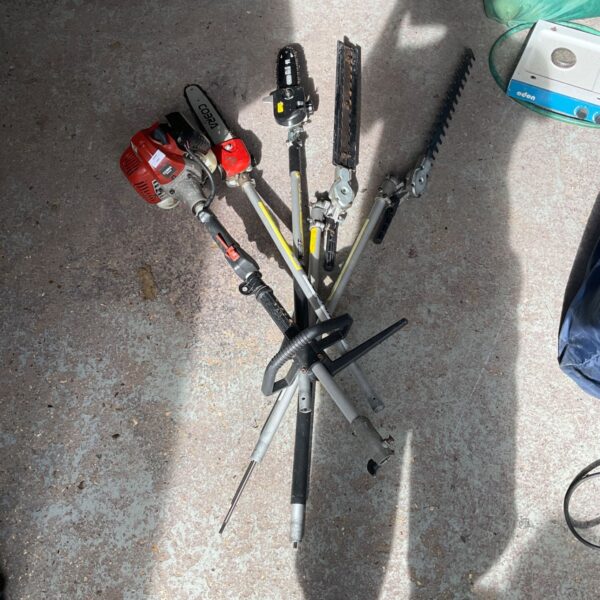 Cobra M250C multitool with hedge trimmer, grass trimmer, and pole pruner attachments.
