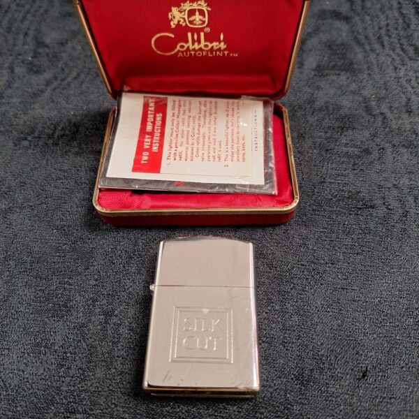 Vintage Colibri AutoLite lighter with Silk Cut branding in original box.