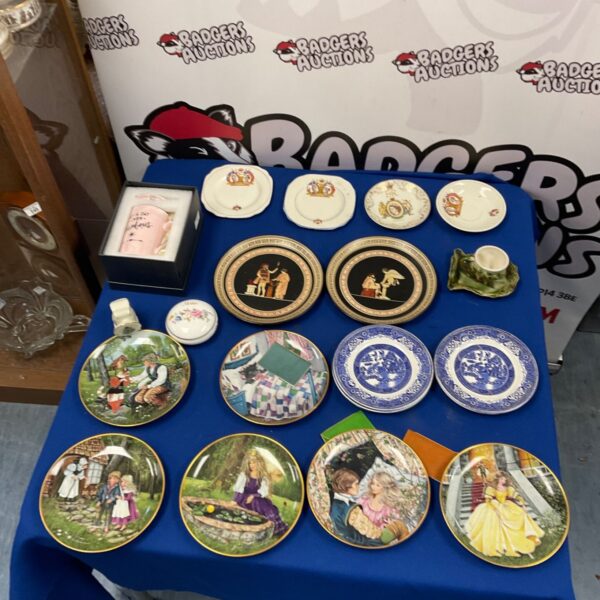 Collection of vintage blue and white collectors plates for display.