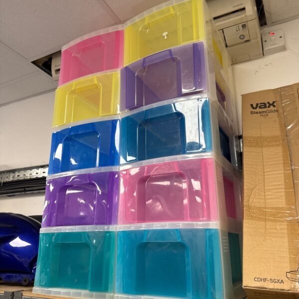 Brightly coloured plastic storage cabinets with five drawers.