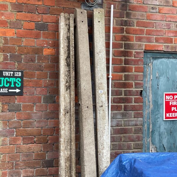 Lot of three weathered concrete fence posts for garden fencing.
