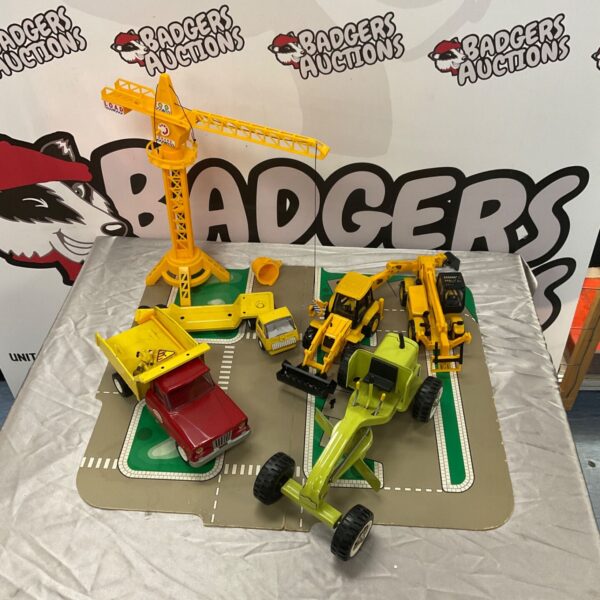 Assorted construction toys including JCB Turbo and Tonka truck.