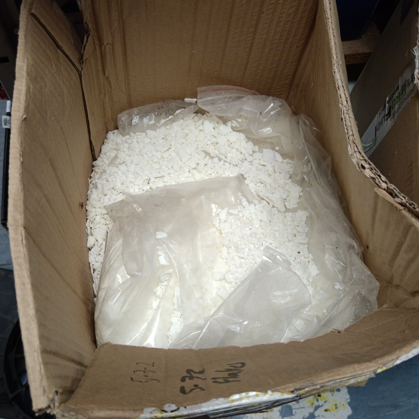 Box of white crafting wax flakes for arts and crafts.