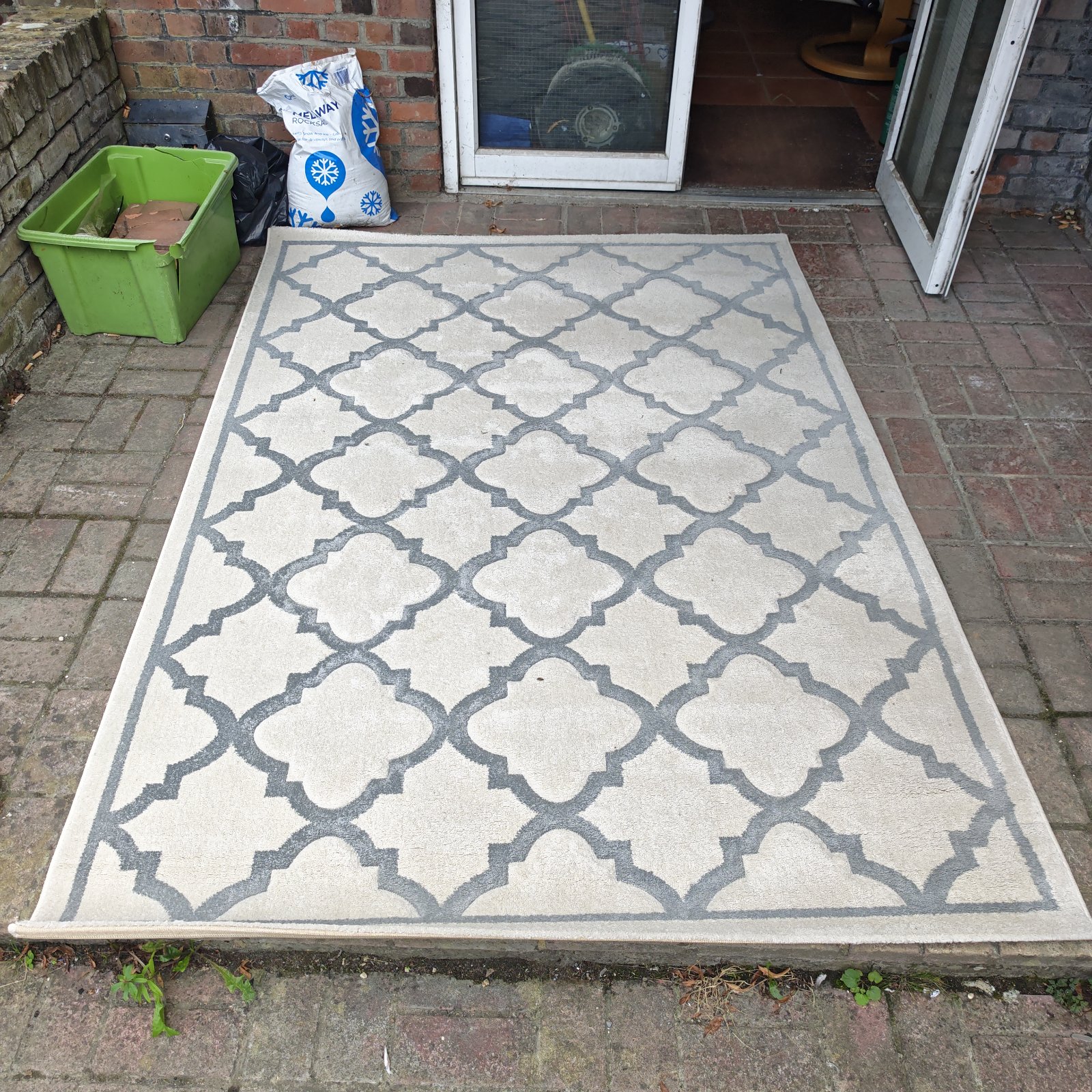 Large cream and grey tile effect rug for home decor.