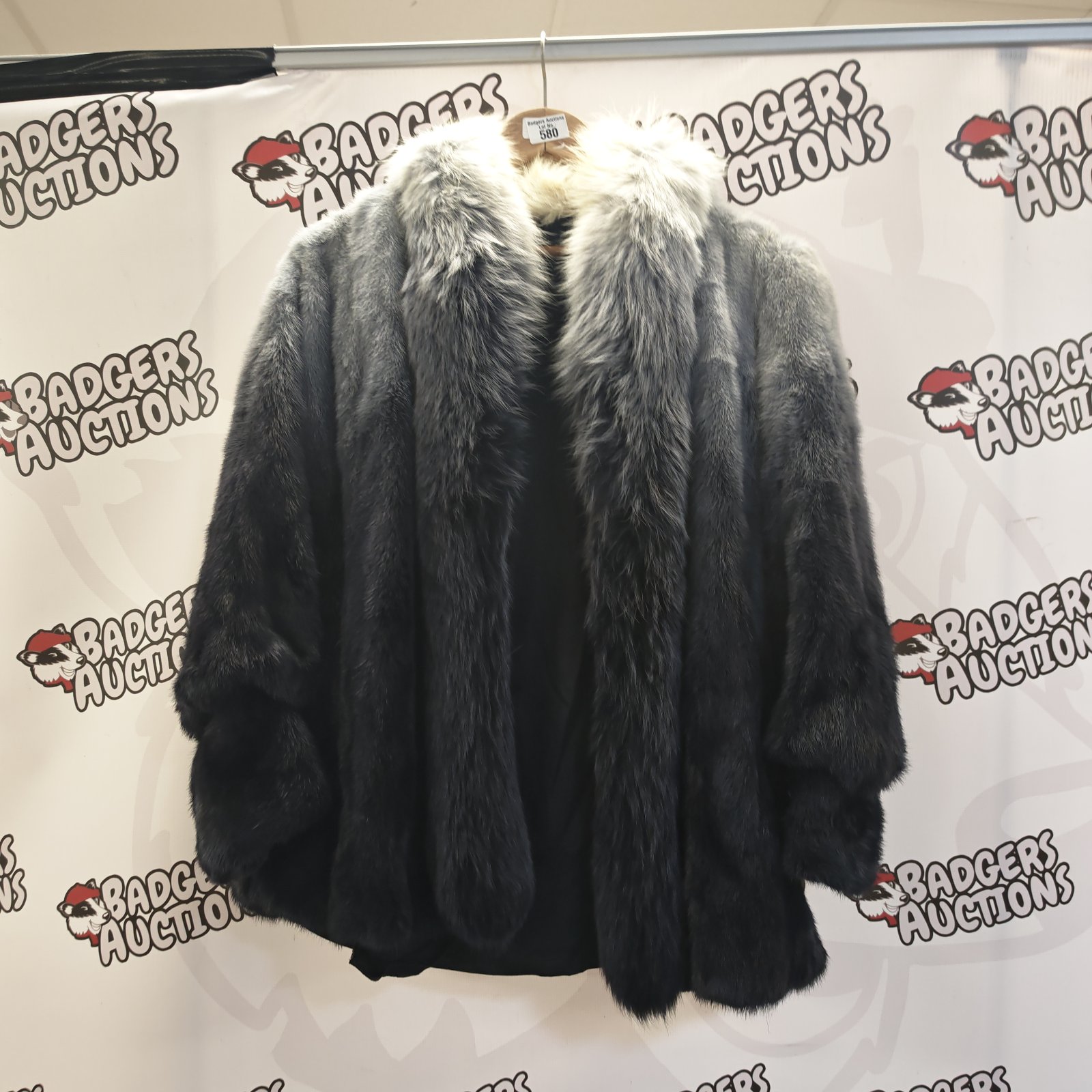 Stylish cream and navy blue faux fur jacket, a statement winter coat.
