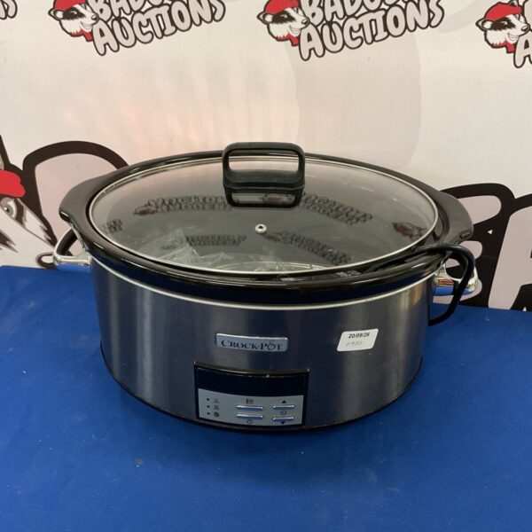 Crockpot slow cooker with stoneware insert and lid.