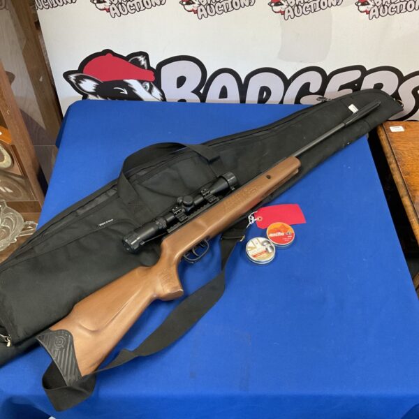 Crossman Nitro Venom .22 caliber air rifle with scope and case.