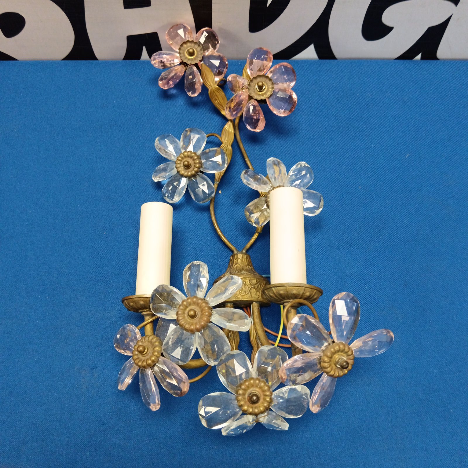 Vintage brass wall sconce with crystal flower details.