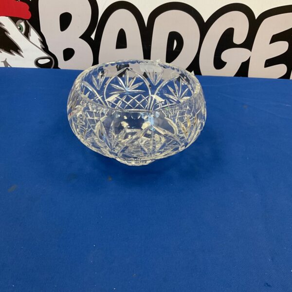 Vintage crystal fruit bowl with starburst cut glass pattern.